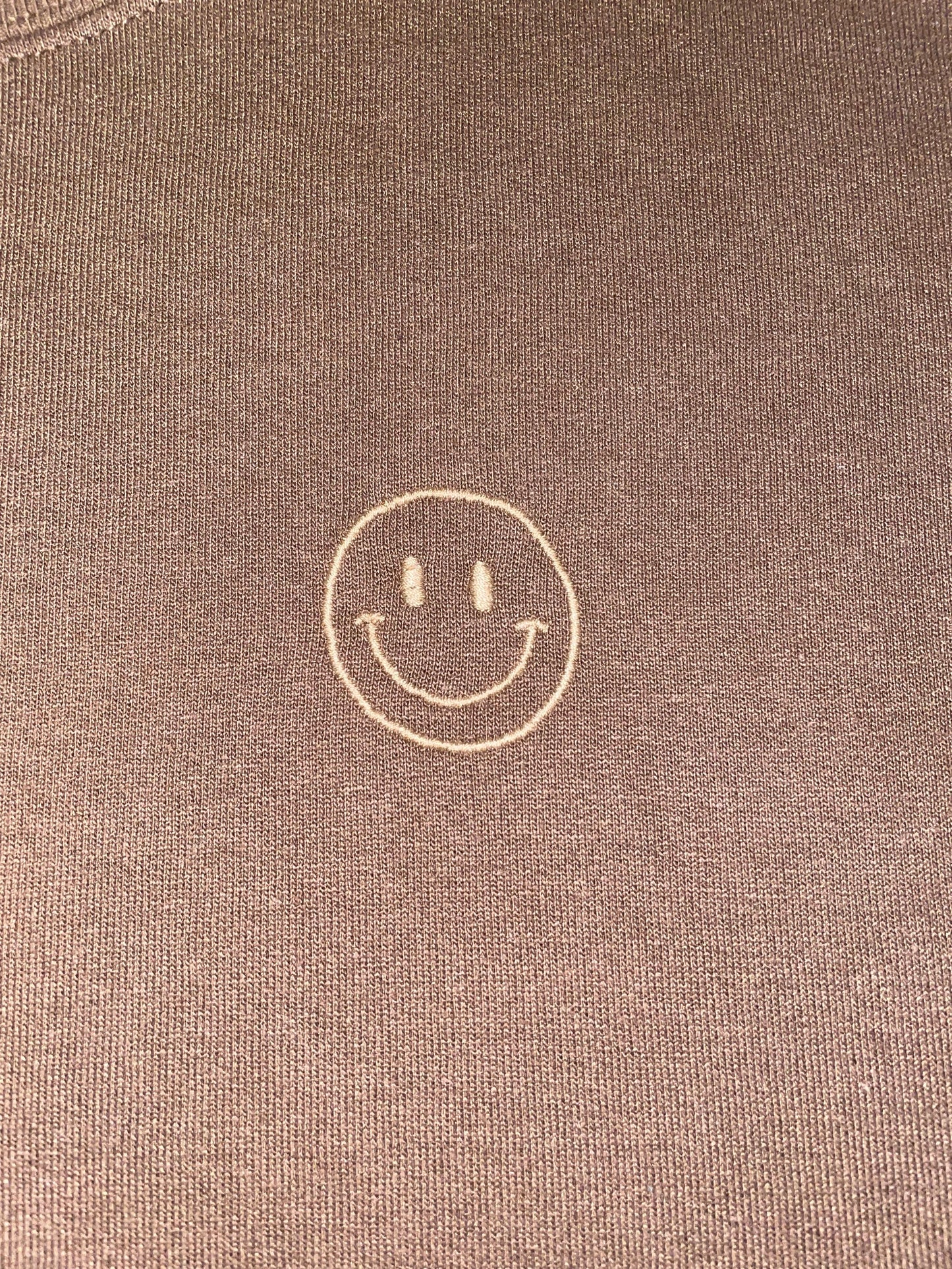 Sudadera con cara sonriente