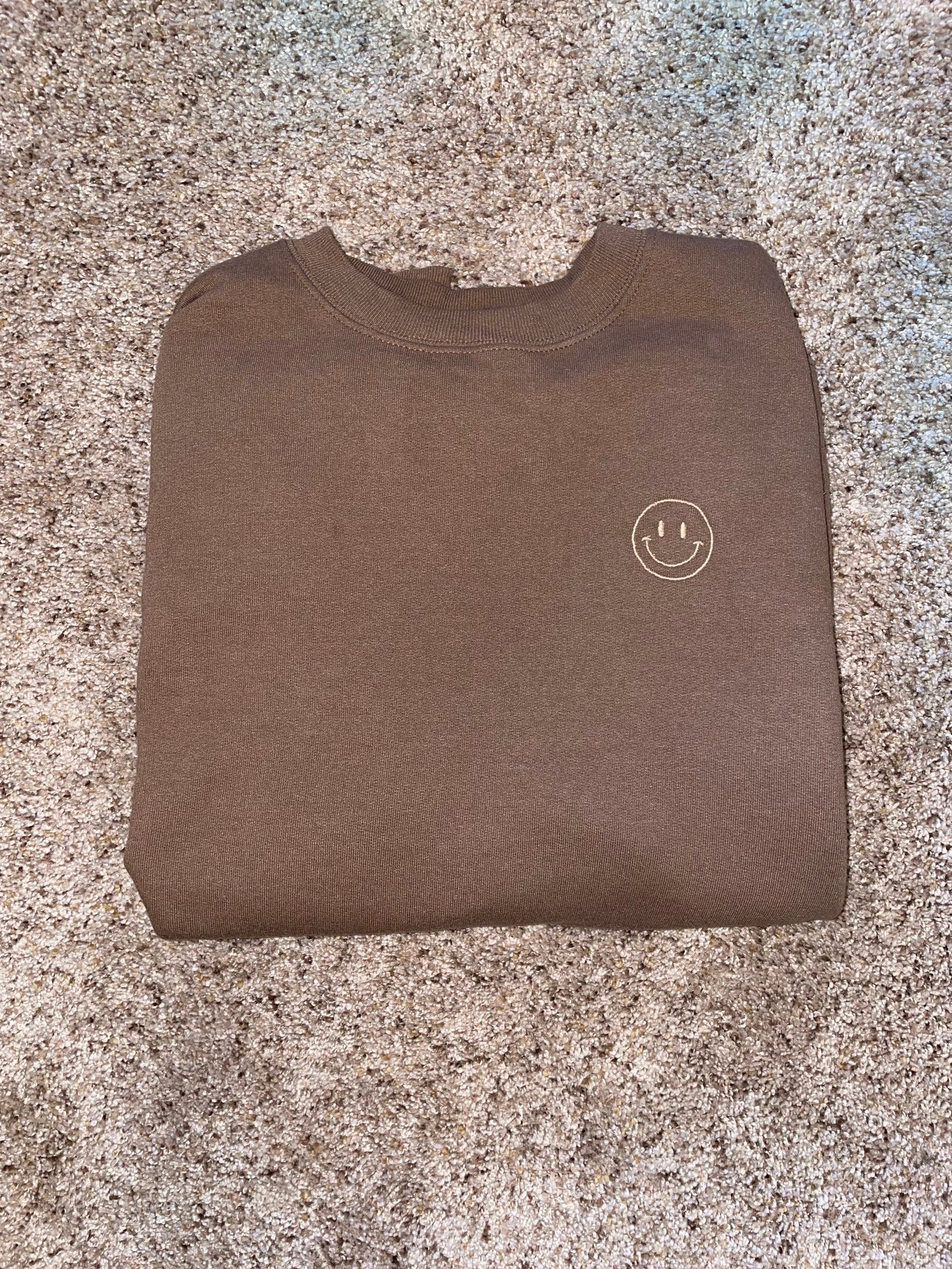 Sudadera con cara sonriente